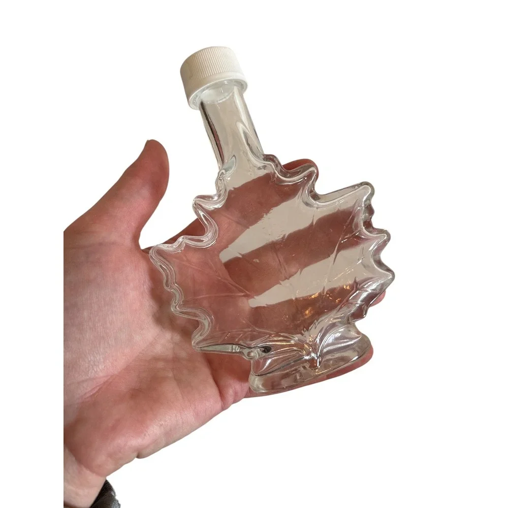 Clear Glass Maple Leaf Shaped Bottle with White Screw Cap Small Syrup Jar Decor
